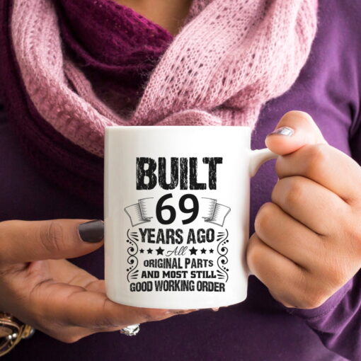 69-Built_11oz white mug woman purple shirt holding_RIGHT-SQ CROP-800